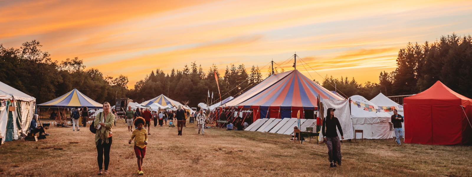 Buddhafield tents and people by sunrise