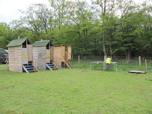 Photo showing a block of six compost toilets